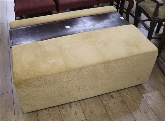 A large box seat ottoman